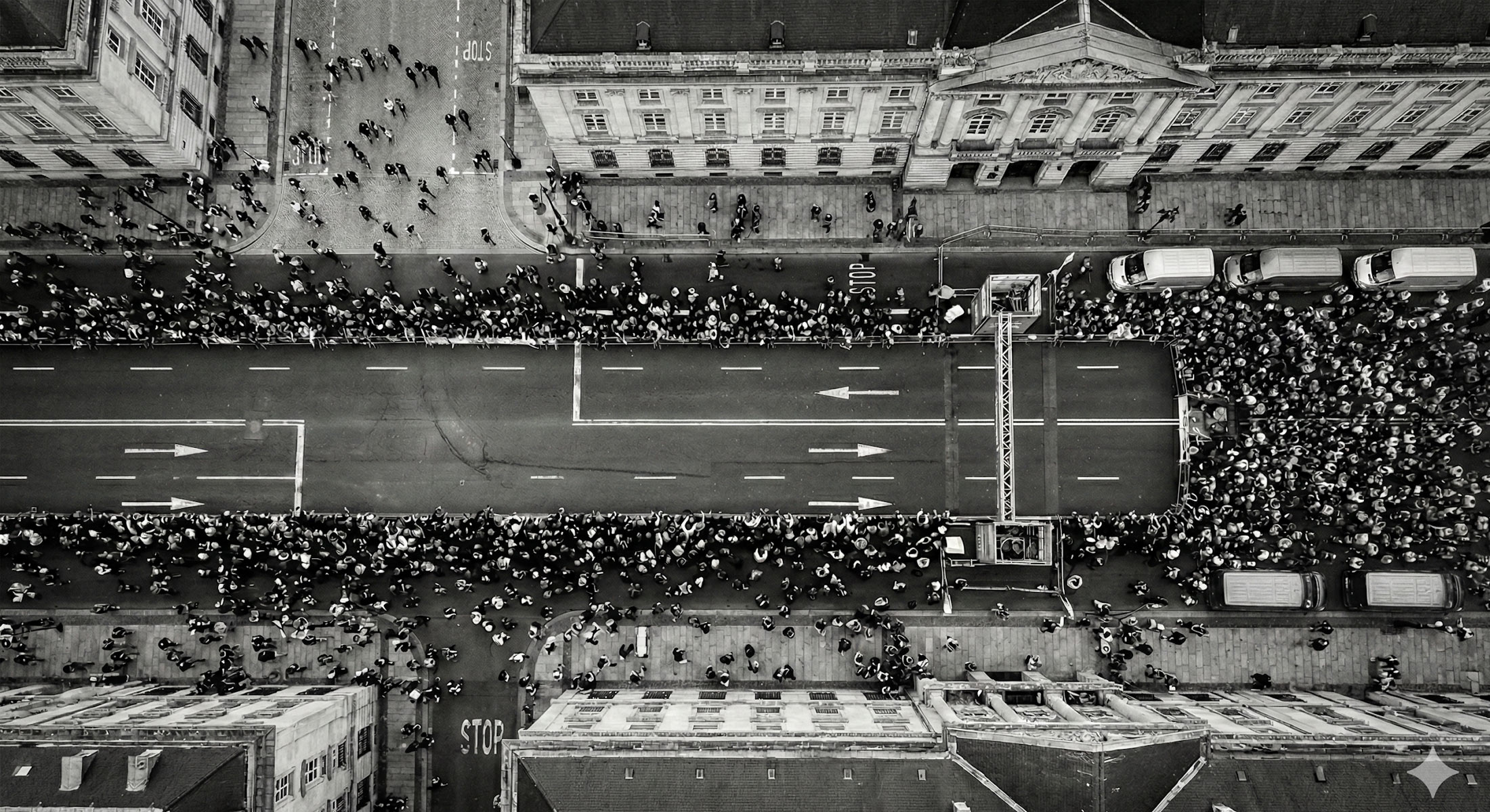 Packed athletics stadium with a running track under floodlights